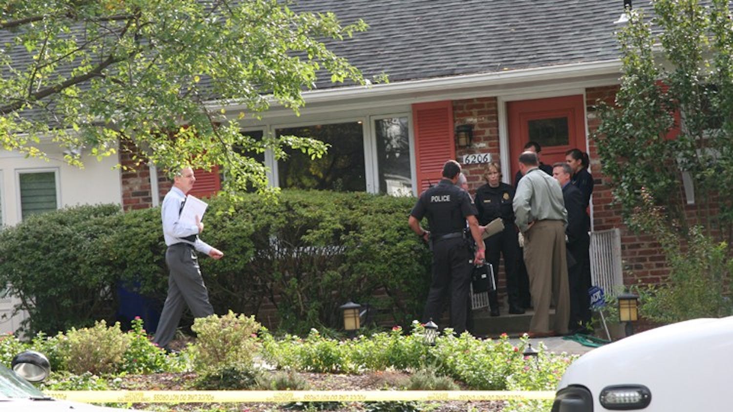 Police investigate the death of Kogod professor Sue Marcum in front of her house in Bethesda, Md.