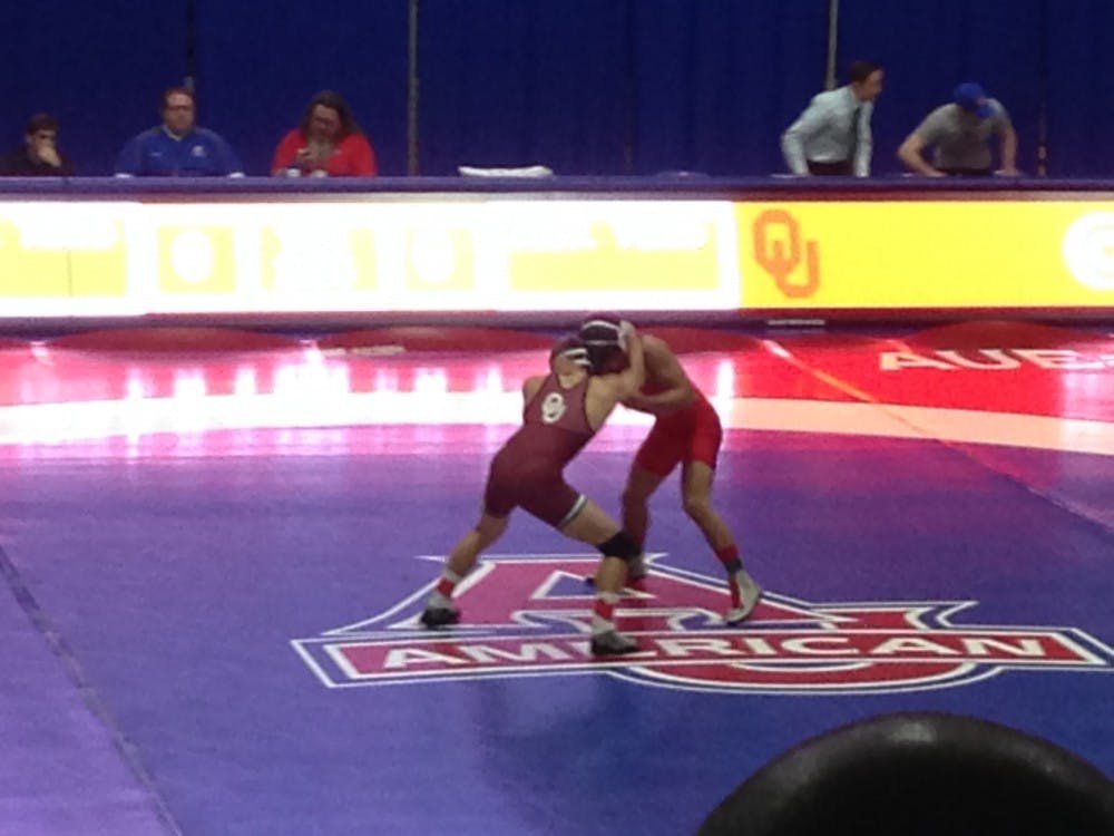 David Terao Jr. wrestles against his Oklahoma University opponent. 