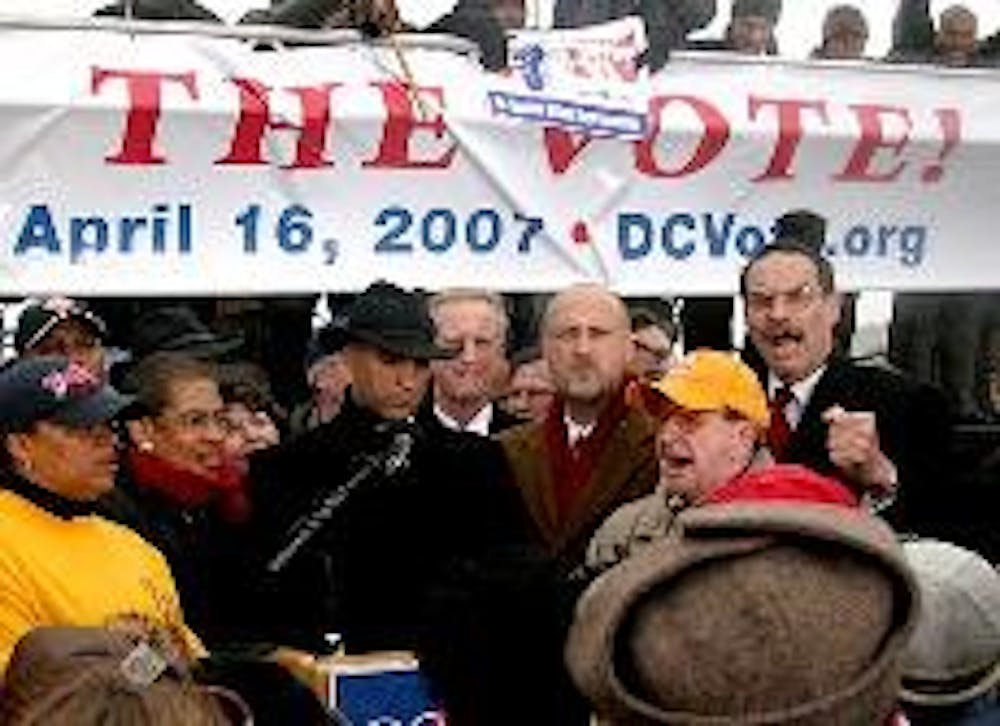 D.C. Mayor Adrian Fenty, D, speaks to a crowd of between 3,500 and 5,000 people that marched to the Capitol building on Monday in support of federal legislation that would give the District of Columbia a voting seat in the House of Representatives.  