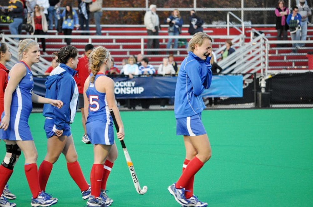 TOUGH LOSS â€” The AU field hockey team reacts after losing to UConn in the first round of the NCAA tournament, 3-2. The Eagles lost in a stroke-off after two overtimes. 