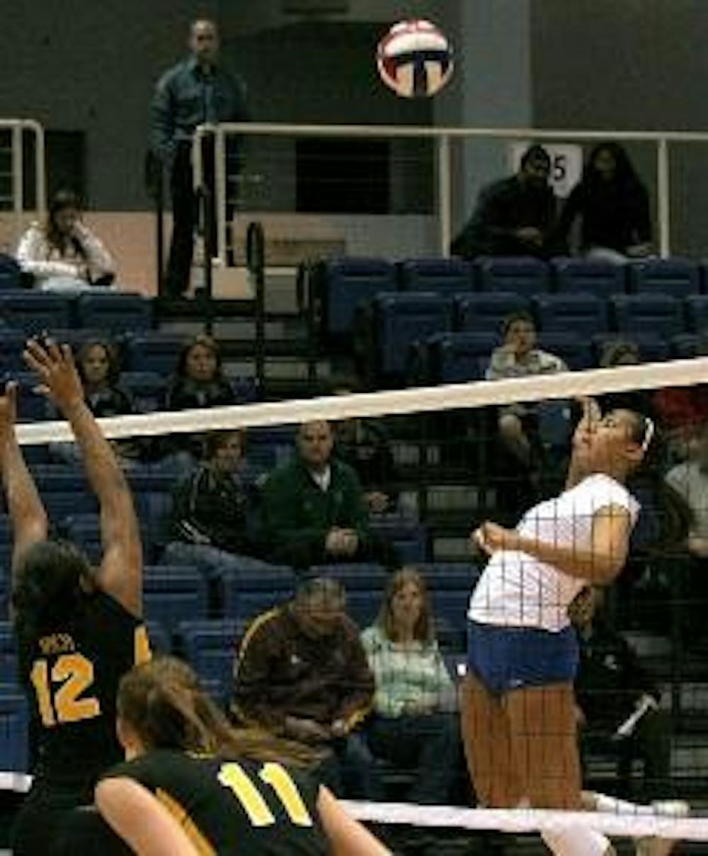 SENIOR DAY SPIKE - Senior Chelsa Brooks defends her court and spikes the ball back to her opponent. Brooks topped off her last home game with five kills and three assists. She was one of three seniors who was recognized in the Senior Day game Tuesd