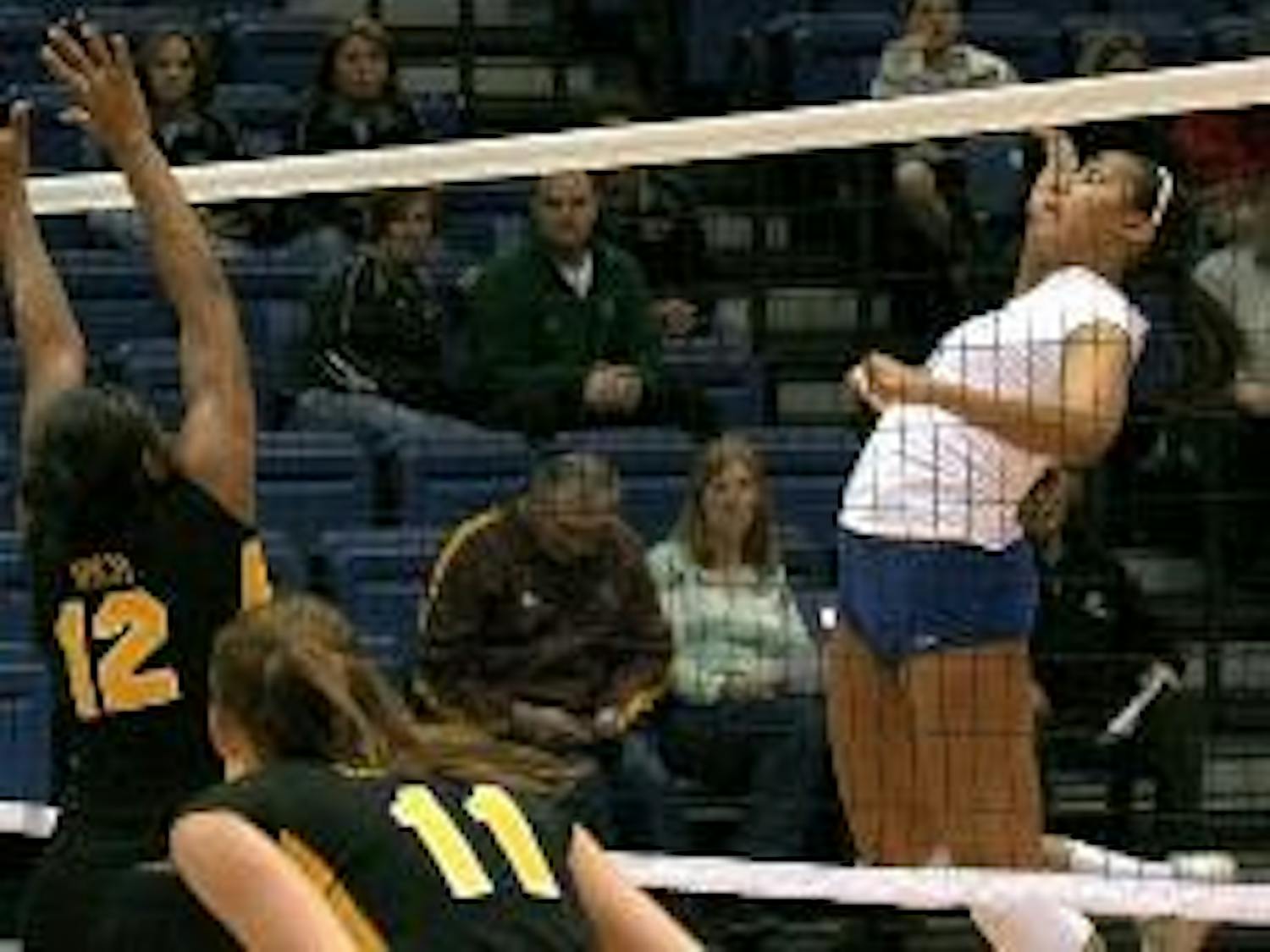 SENIOR DAY SPIKE - Senior Chelsa Brooks defends her court and spikes the ball back to her opponent. Brooks topped off her last home game with five kills and three assists. She was one of three seniors who was recognized in the Senior Day game Tuesd