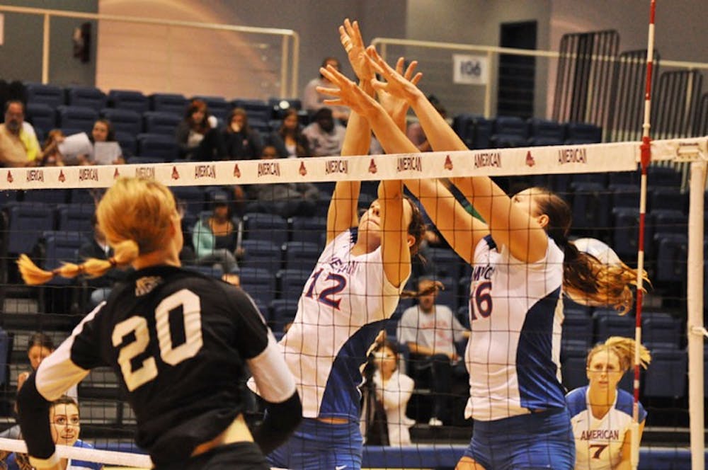 BIG BLOCK â€” Seniors Katerina Cinkova (12) and Magdalena Tekiel (16) go up for the block in their 3-0 win over Holy Cross. 
