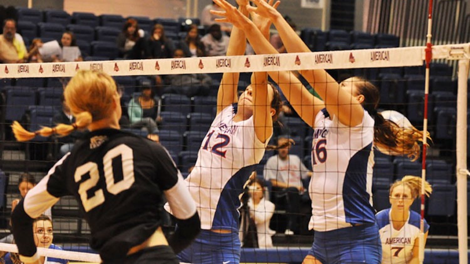 BIG BLOCK — Seniors Katerina Cinkova (12) and Magdalena Tekiel (16) go up for the block in their 3-0 win over Holy Cross.