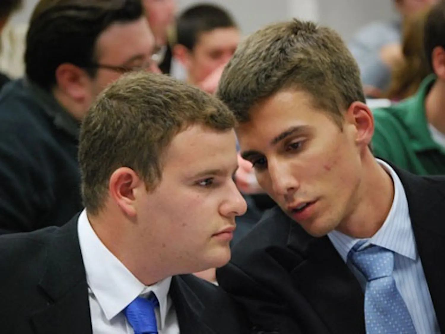 PLANNING THE DEFENSE -- Respondent Matt Handverger confers with his special counsel, Tommy Fijacko, during the Tuesday night segment of Handverger\'s impeachment proceedings.