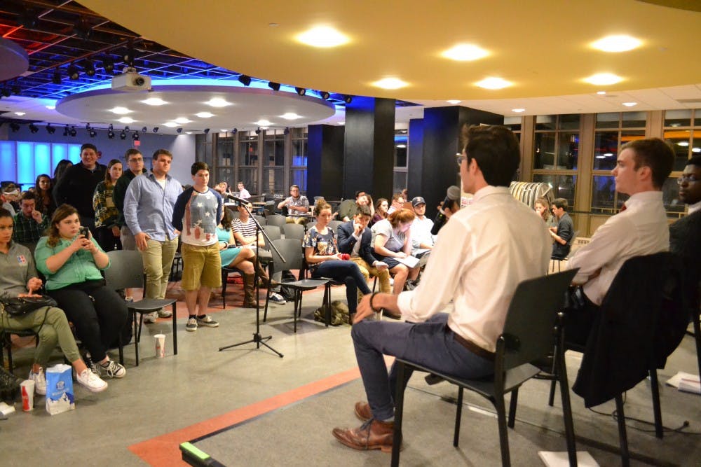The three presidential candidates, Will Mascaro, Matt Mullin and&nbsp;Devontae Torriente take questions from students during a town hall on March 17.