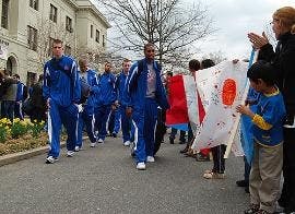 RALLYING FOR THE TEAM - Students, faculty, staff and members of the community cheer on the AU men\'s basketball team in front of Mary Graydon Center. The team departed for their first-ever NCAA tournament appearance in Birmingham, Ala., yesterday following