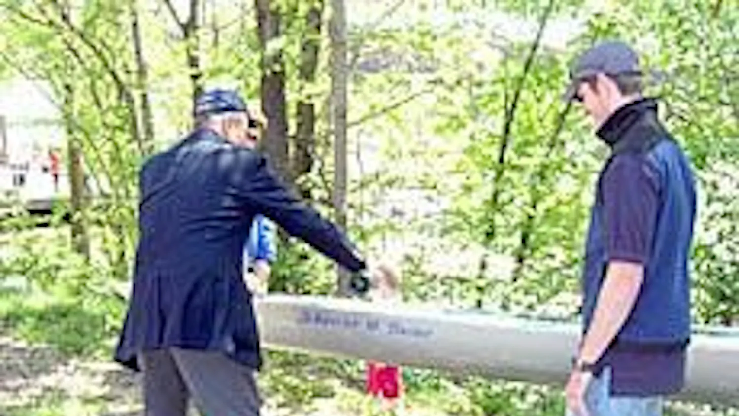 Pierre Han christens the new boat, which was renamed "Sweet Caroline."