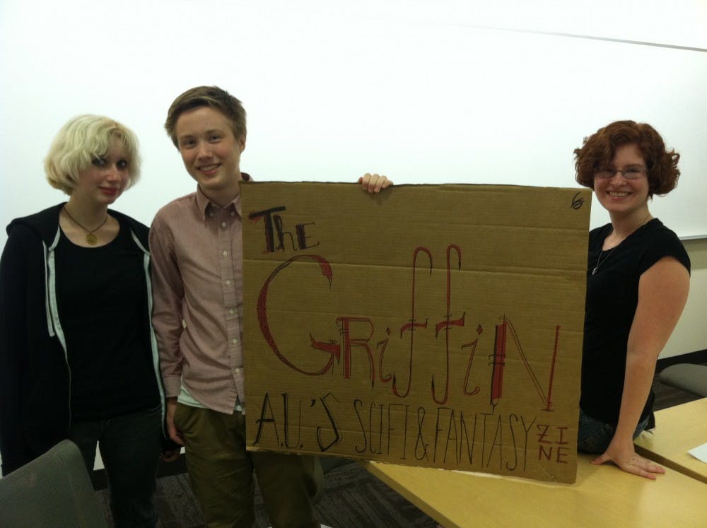 	The Griffin’s Vice President Mariel Stratford, President Brendan Williams-Childs and Treasurer Caitlin Friess pose with a sign of The Griffin after its general interest meeting on Sept. 4.