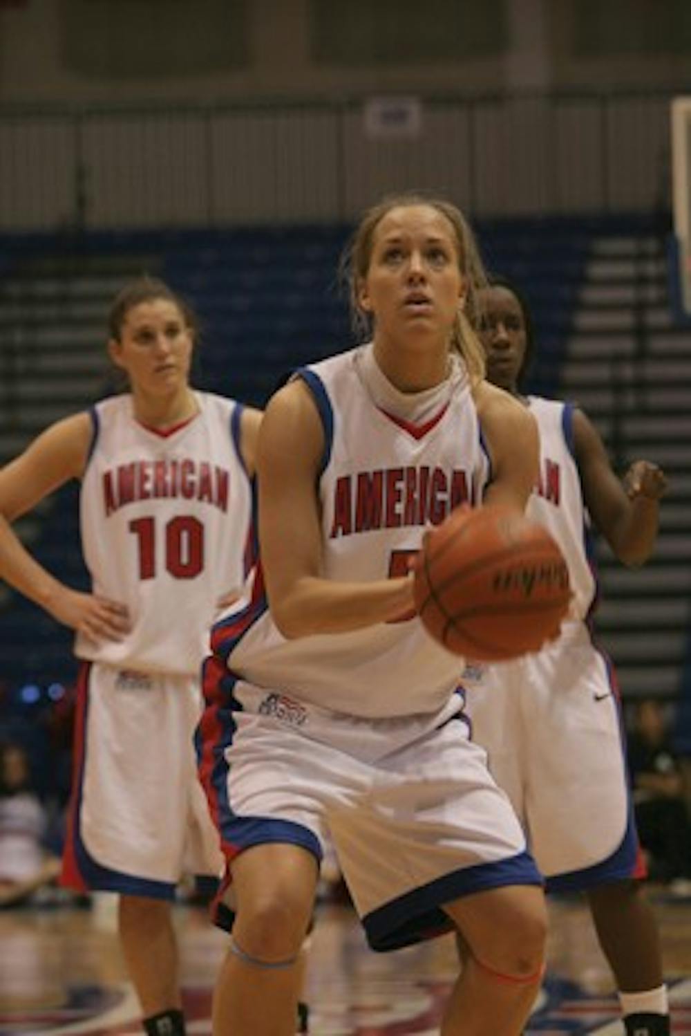 CONCENTRATION â€” Michelle Kirk stands at the line to shoot free throws in an away game. Kirk was the driving force behind the womenâ€™s victory , scoring a game high-21 points and had eight rebounds. 