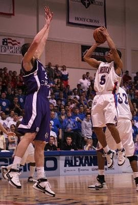 DON'T GIVE UP- Though it looked grim in the beginning (below), Blue Crew fans never gave up on their Eagles. No. 5 Garrison Carr (above) gave the fans plenty to cheer about in the second half. Carr scored 11 points in the second half, including three thre