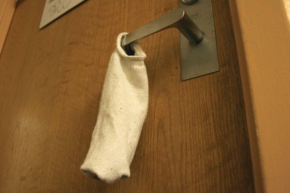 LOVE LOCKDOWN â€” Socks on the door handle usually mean only one thing â€” do not enter! Tufts University instituted a school-wide policy against â€˜sexilingâ€™ earlier this year. AU has no plans to implement a similar rule. 