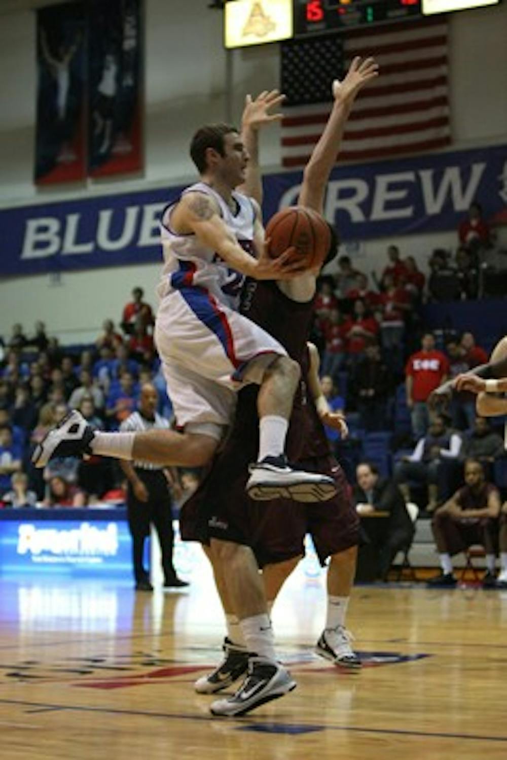 DRIVING THE RIM â€” AU brings the ball up the court in their 73-63 win before a full Bender Arena on Sunday. It puts them in a four way tie for fourth place in the Patriot League standings. They play Holy Cross for their Phil Bender event Saturday.