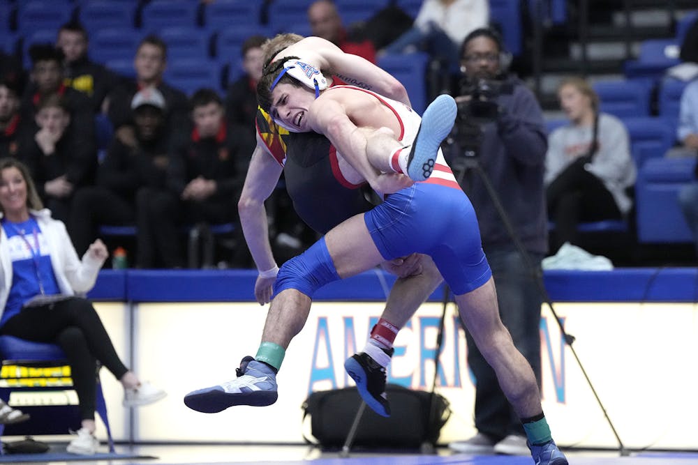 Wrestling falls to Maryland in opening night battle 