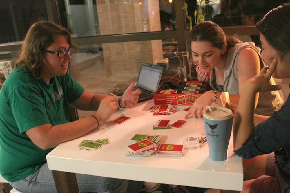 GET YOUR FIX -- Sophia Geskin, Amanda Ludden and Jennifer Storozum pass the time in The Perch, Centennial Hall\'s newest addition, where students can purchase drinks for only $1.