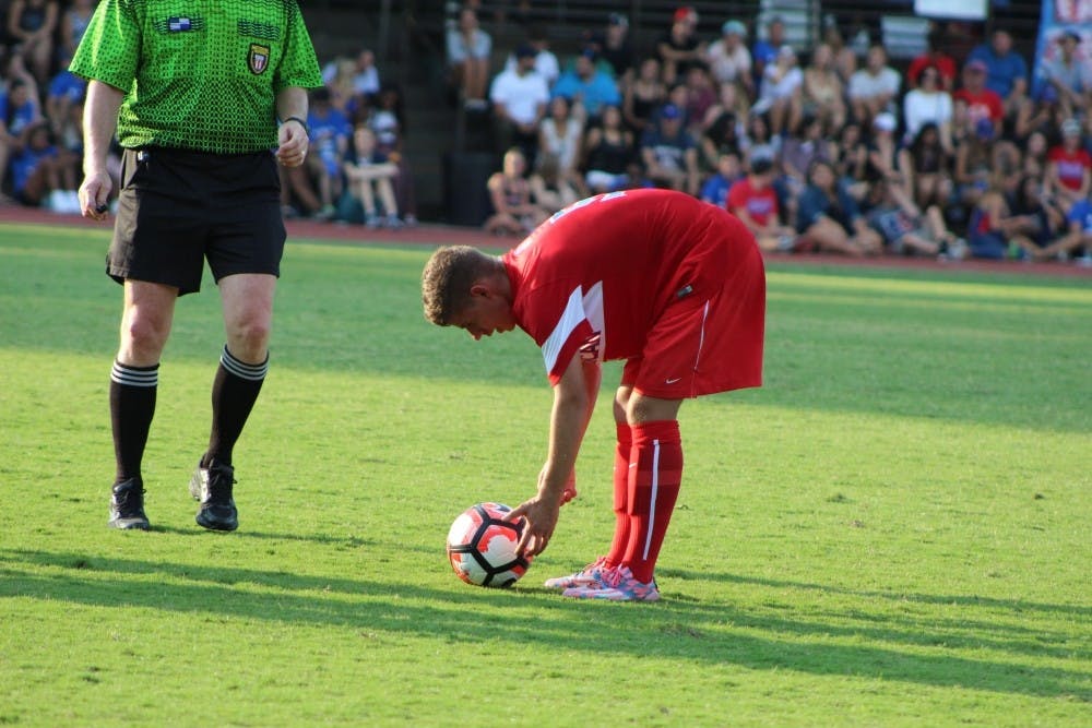 Sophomore Tim Neumann places the ball for a free kick in a photo taken from the 2016 season.