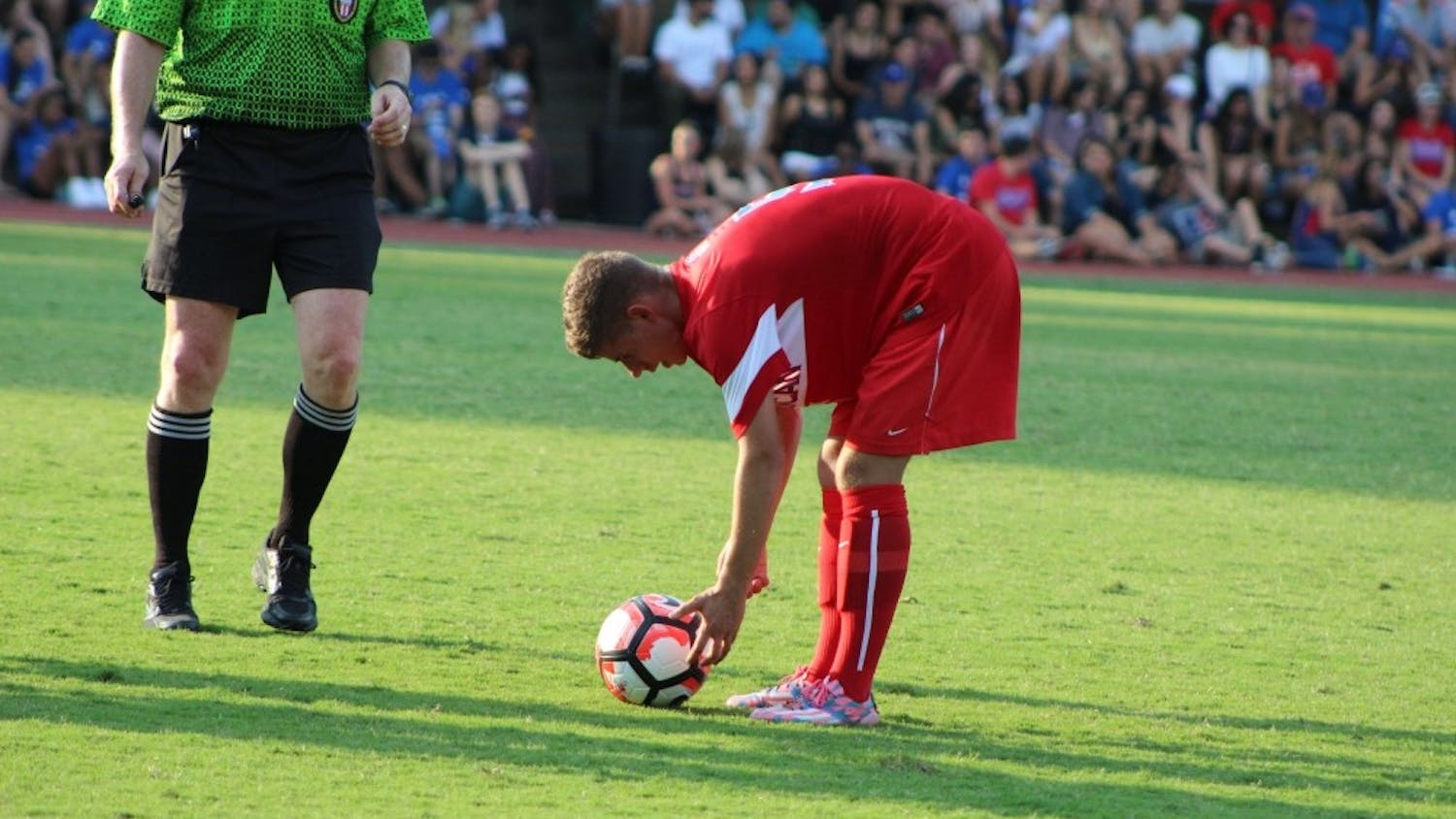 Sophomore Tim Neumann places the ball for a free kick in a photo taken from the 2016 season.