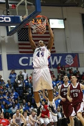 SLAM DUNK - Senior forward Jordan Nichols scores two of his 11 points on this dunk during the Eagles' 78-65 Phil Bender victory Saturday. Nichols was one of three AU players to get double digits in points during the game.