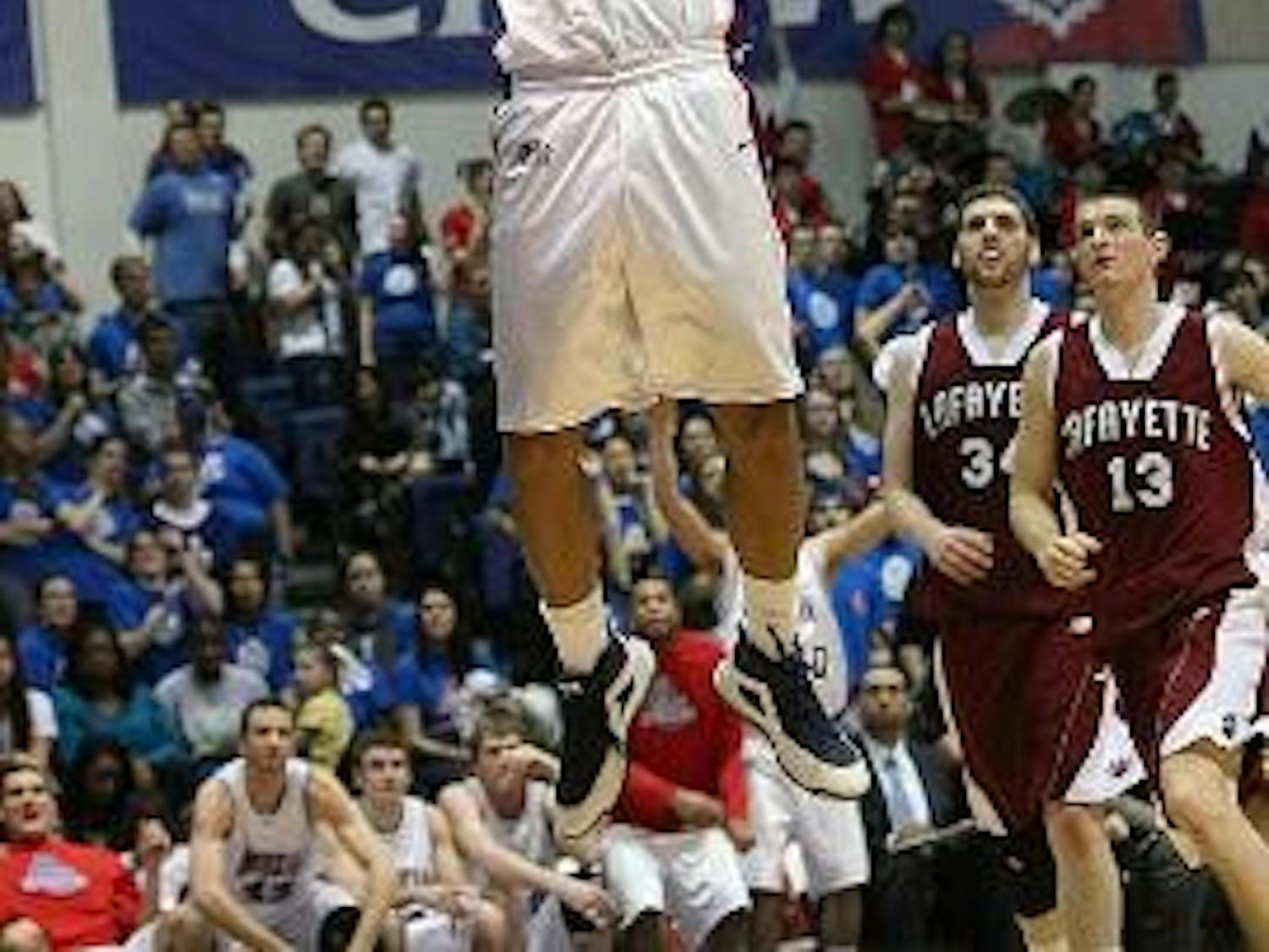 SLAM DUNK - Senior forward Jordan Nichols scores two of his 11 points on this dunk during the Eagles' 78-65 Phil Bender victory Saturday. Nichols was one of three AU players to get double digits in points during the game.