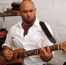 HANDY MAN - Justin Reyna was one of 100 vendors selected to showcase his crafts at this year's Crafty Bastards in Adams Morgan. Reyna sold his handmade guitars and sound parts, which he carefully constructs in the garage of his Silver Spring, Md., home.