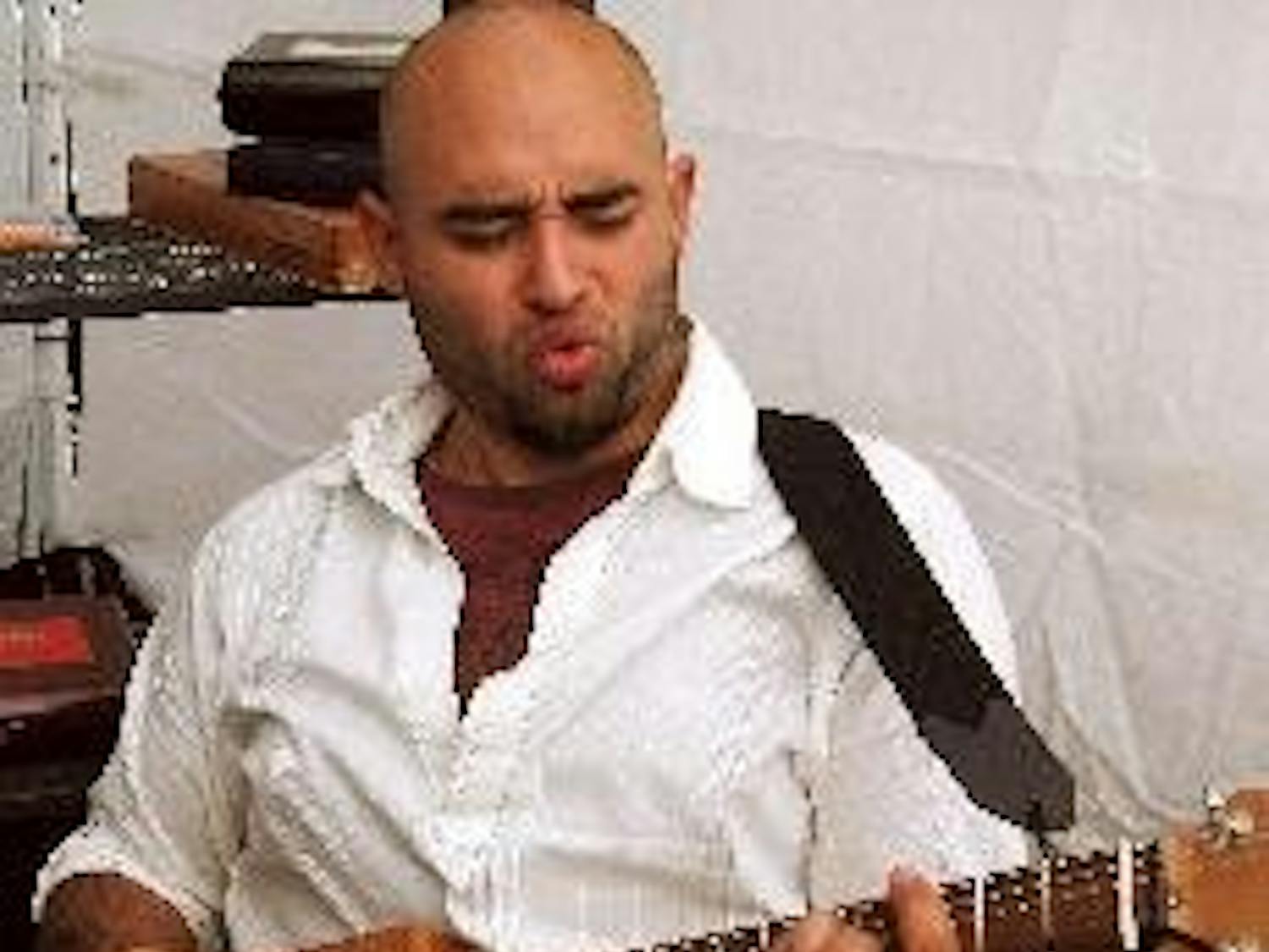 HANDY MAN - Justin Reyna was one of 100 vendors selected to showcase his crafts at this year's Crafty Bastards in Adams Morgan. Reyna sold his handmade guitars and sound parts, which he carefully constructs in the garage of his Silver Spring, Md., home.