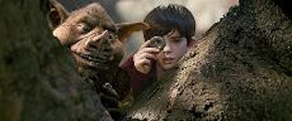 BOOGEYMEN - Freddie Highmore plays twin brothers Jared and Simon Grace in the new children's movie "The Spiderwick Chronicles," based on the popular book series in which the boys explore their New England town. When Jared finds a field guide that tells th