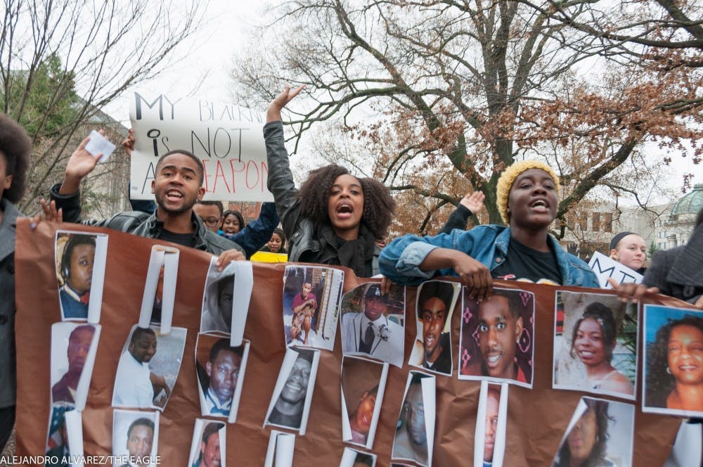 About 200 students marched around campus in "The Darkening," a rally in solidarity with the nationwide "Black Lives Matter" movement. 