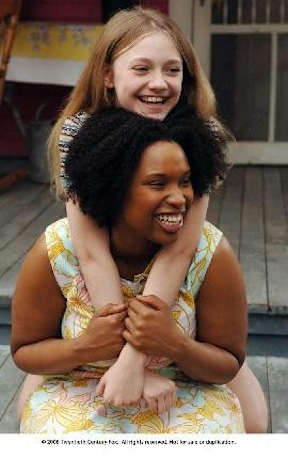 LIVING LIFE - Dakota Fanning and Jennifer Hudson (right) are among the all-star cast of "The Secret Life of Bees." The film, also starring Queen Latifah (below) and Alicia Keys, details the life of runaway Lily Owens (Fanning) as she is taken in by trio o