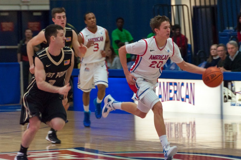 	No. 20 freshman Charlie Johnson dribbles the ball down the court in a Feb. 22 game against Army.