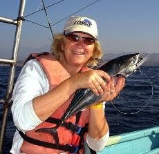 HOG WILD - Sarah Menke-Fish, a professor in the School of Communication, discusses growing up on a farm in Iowa, where she showed a pig in a "prettiest pig" contest. 