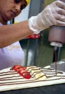 SWEET AND SAVORY - Crepeaway's owner, Saad Jallad, suggests "The Angel," pictured above, for customers with a sweet tooth. It is made with strawberries, bananas and Nutella.