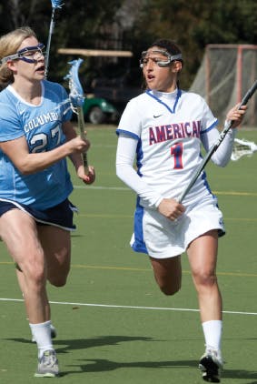 Kimberly Collins races past a Columbia defender during a game earlier this season. The junior leads the team with 41 points this year. 

