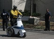 A NEW RIDE - A Public Safety officer rides past the Ward Circle Building on one of the office's new T3 scooters. They purchased three of the scooters and extra batteries for $34,000. The purchase replaced one Public Safety patrol car, according to Chief M