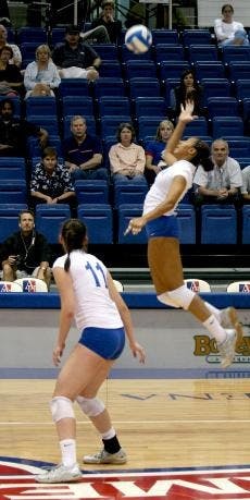 JUMP START- Senior Chelsa Brooks brings AU volleyball to new heights, jumping to return the ball, leading her team to victory. AU hosted the American Volleyball Tournament this past weekend in Bender.