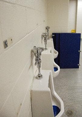 DAMAGE CONTROL - Vandals ripped out the dividers between the urinals in the men's bathroom of Bender Arena during Relay For Life between Friday night and Saturday morning. It is unclear who will have to pay for the repairs. 