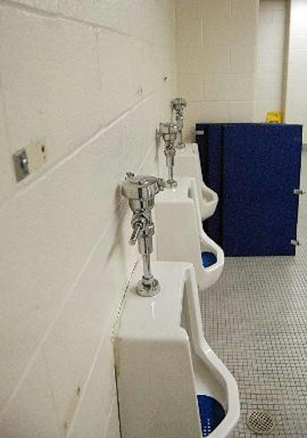 DAMAGE CONTROL - Vandals ripped out the dividers between the urinals in the men's bathroom of Bender Arena during Relay For Life between Friday night and Saturday morning. It is unclear who will have to pay for the repairs. 