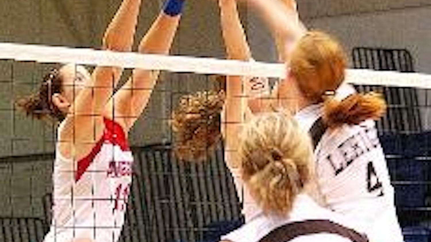 HANDS UP - Senior setter Christina Nash (No. 11) and junior middle blocker Claire Recht team up to block their Lehigh opponents in Saturday's 3-0 victory over the Mountain Hawks.  The Eagles have won five straight matches and 15 consecutive sets during th