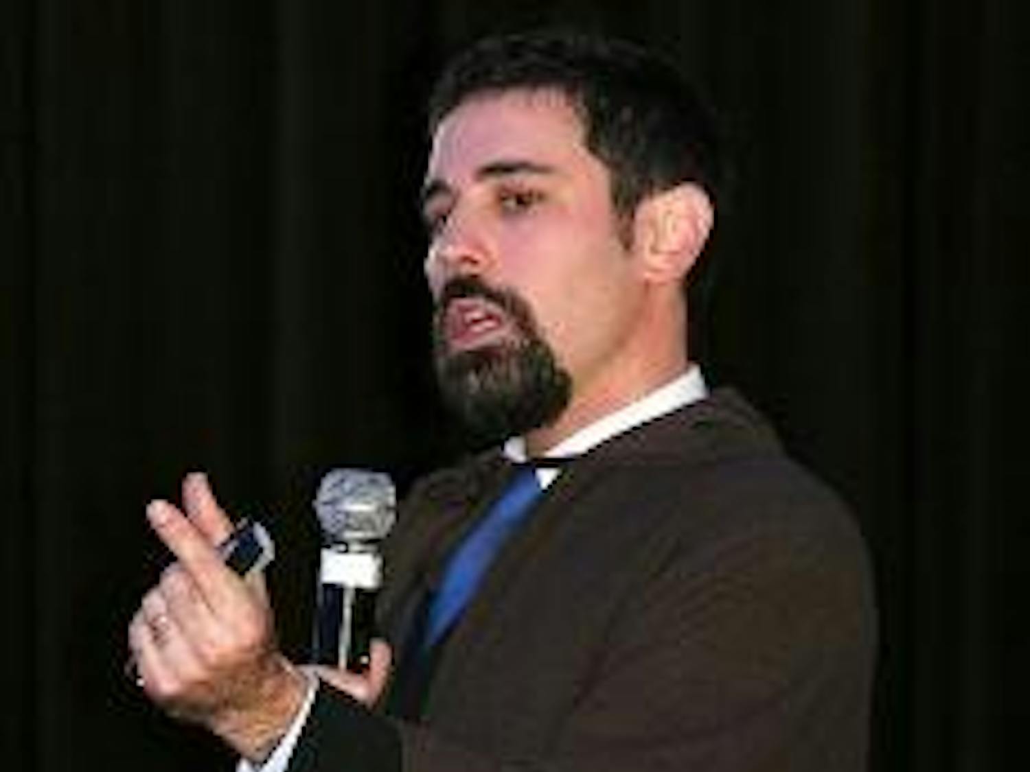 SIS professor Patrick Jackson puts a Darth Vader stranglehold on a speech about "Star Wars" in the Tavern Wednesday night. Jackson explained the style of the Star Wars story, some of George Lucas' influences while making the film and its relation to World