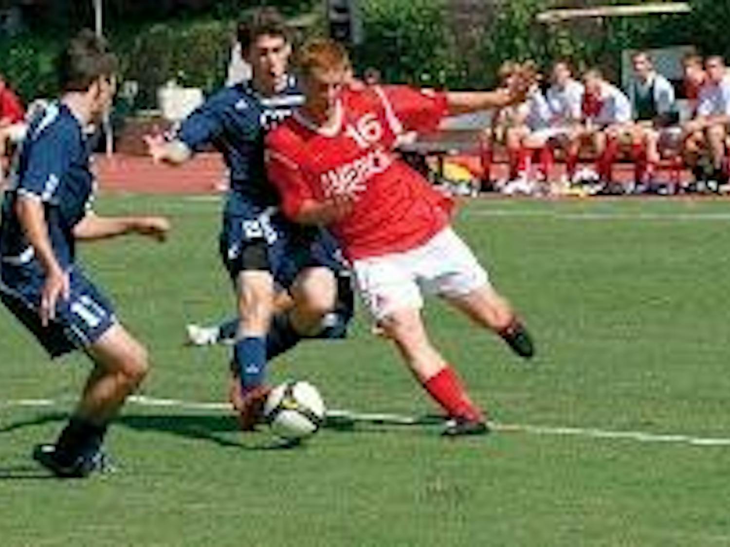 TURNING THE CORNER - Sophomore midfielder Jamie Davin looks to get around his GW opponent during the Eagles 2-0 defeat on Saturday afternoon. The Eagles have only scored one goal in their past three games.
