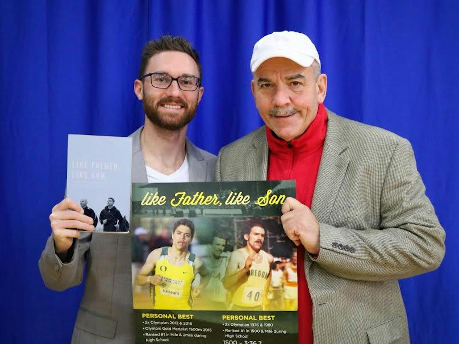 Assistant track coach&nbsp;Chris&nbsp;Kwiatkowski, left, and head coach&nbsp;Matthew Centrowitz, Sr. pose with Centrowitz's memoir "Like Father, Like Son," which was published on January&nbsp;19.