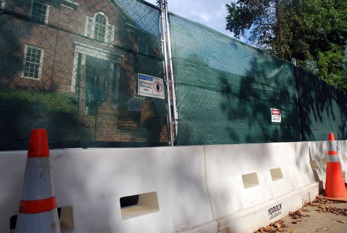 DO NOT CROSS - Cones and fencing block-off the Army Corps dig where an open vial of mustard gas was  found on Aug. 12 in the Spring Valley neighborhood behind the Public Safety building.