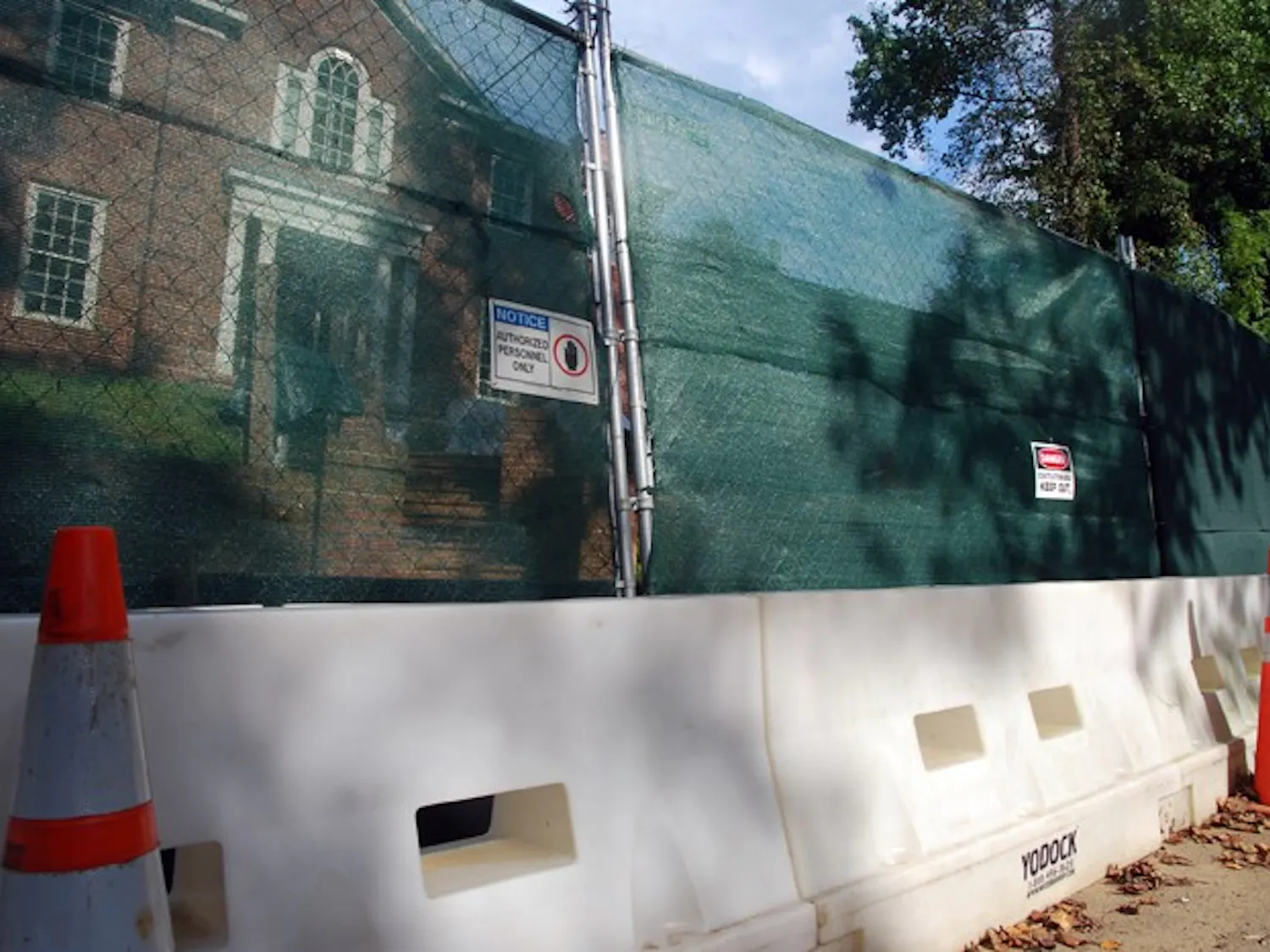 DO NOT CROSS - Cones and fencing block-off the Army Corps dig where an open vial of mustard gas was found on Aug. 12 in the Spring Valley neighborhood behind the Public Safety building.