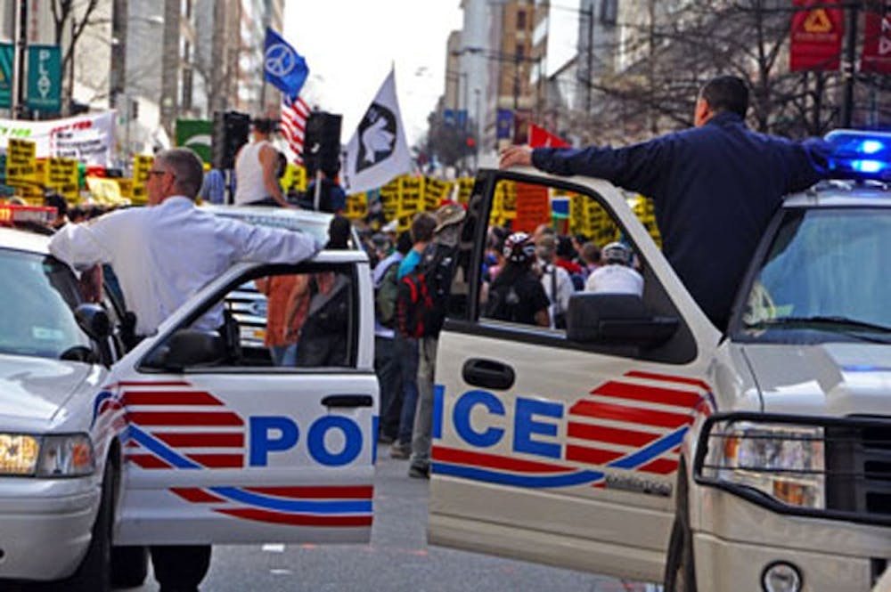 NO NONSENSEâ€” Protests bloomed across D.C. last weekend as AU students participated in two separate anti-war protests, an anti-health care protest and one for immigration reform. Here, two police officers survey the crowd during Saturdayâ€™s National March on Washington. 