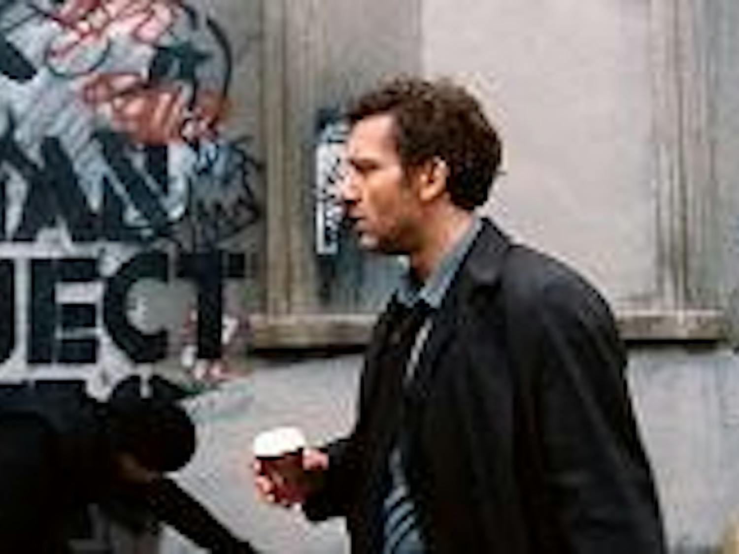 Clive Owen fights to save a pregnant woman in Alfonso Cuar¢n's dystopian science fiction film 'Children of Men.'