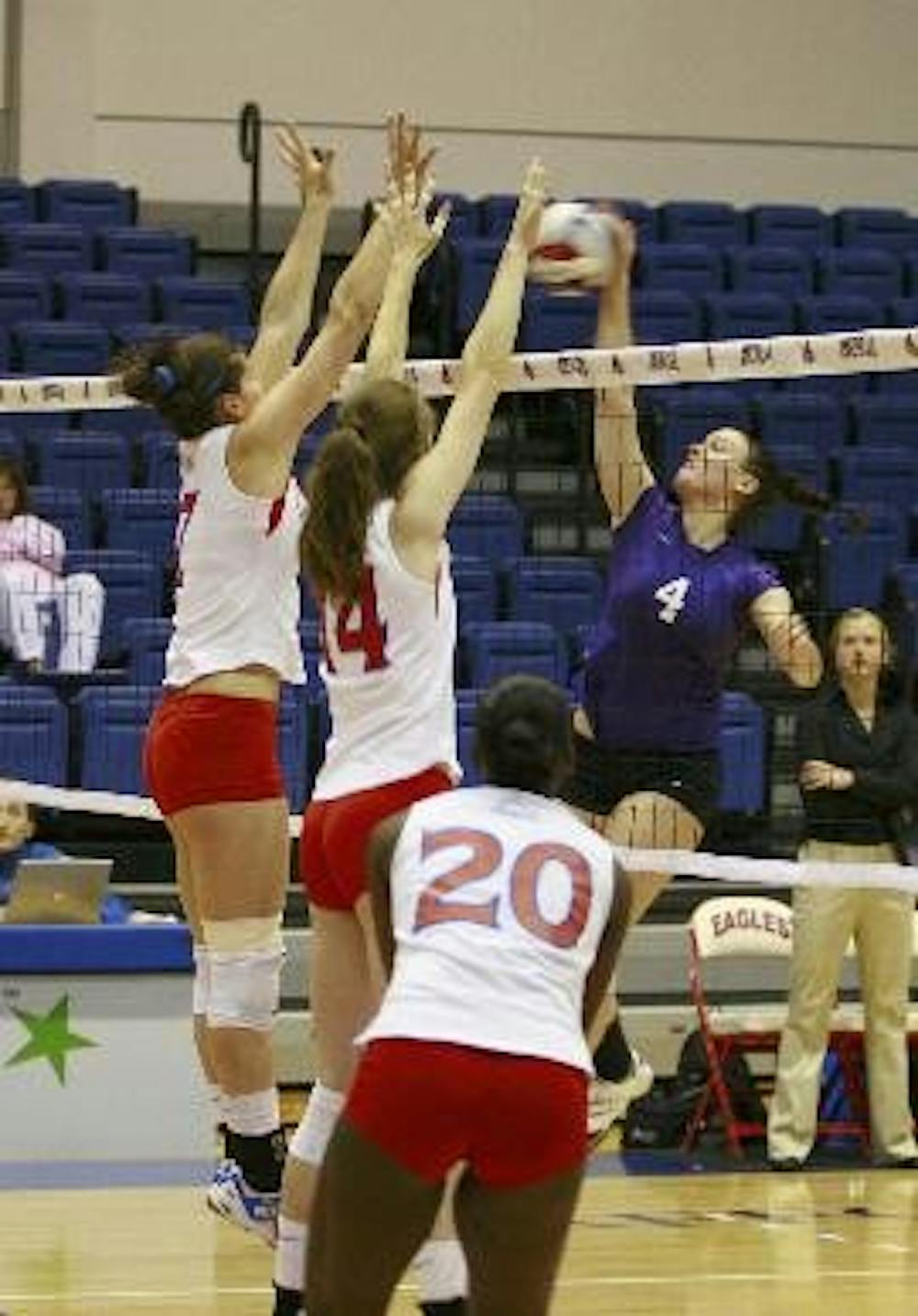 TWIN TOWERS - No. 7 senior outside hitter Rubena Sukaj, No. 14 junior middle blocker Claire Recht and No. 20 sophomore rear setter Angelina Waterman go up for the kill in their 3-0 victory over the Holy Cross Crusaders Saturday.