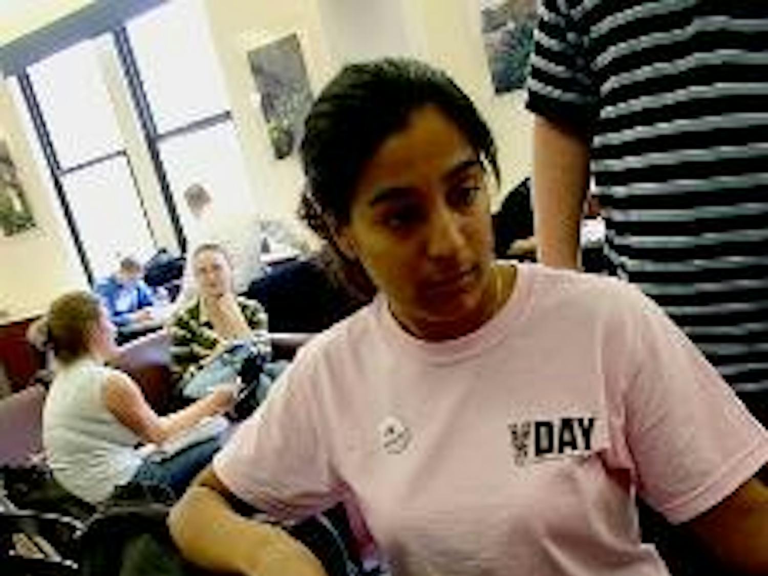 Pooja Virani sells tickets to the seventh annual 'Vagina Monologues,' presented by the Women's Initiative.