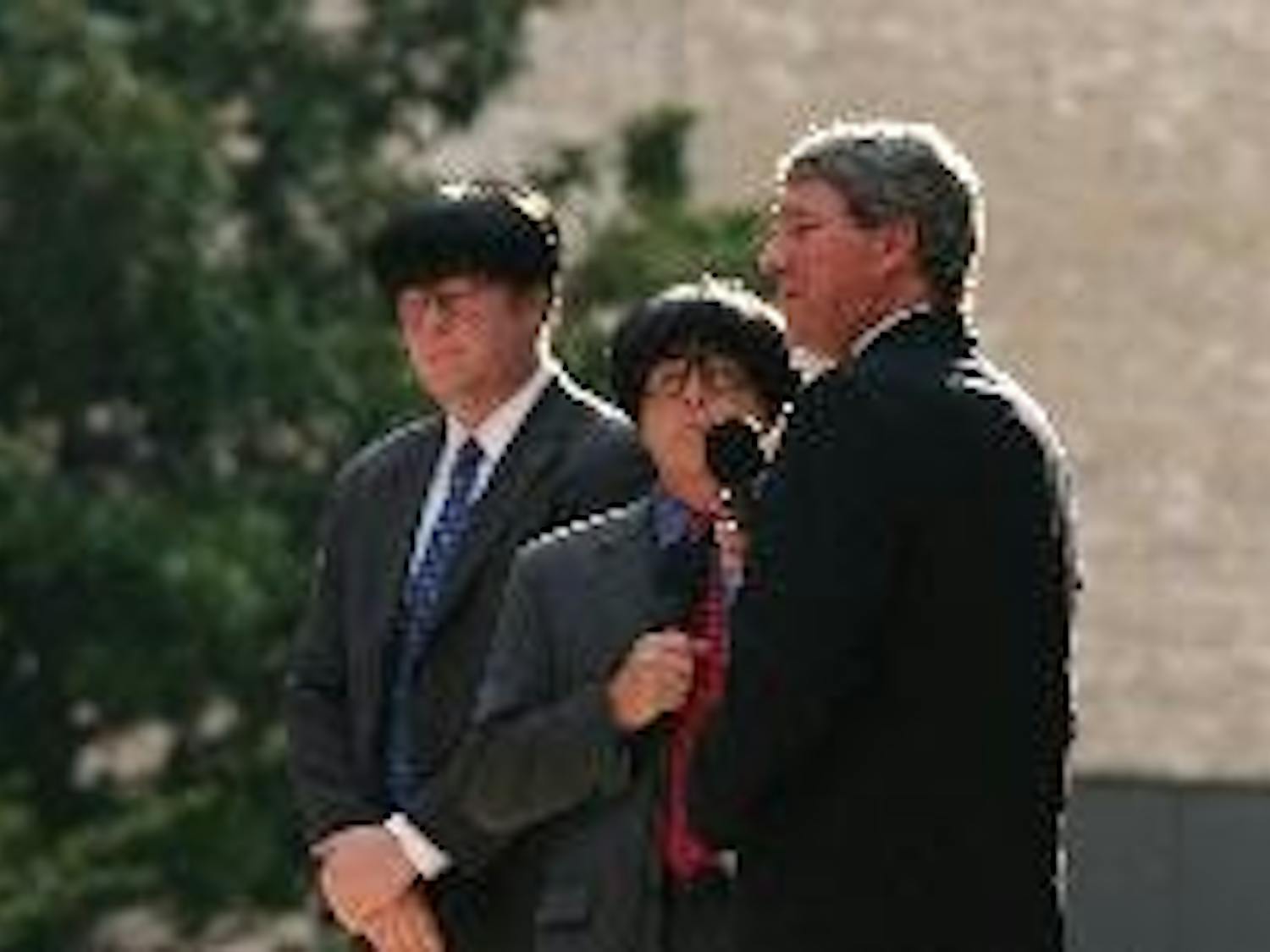 LAST LAUGH - Capitol Steps' Mike Thornton impersonates President Bush struggling with a language barrier while speaking to two Chinese men, played by Jack Rowles and Evan Casey. The group played Sunday night at the Woods-Brown Ampitheatre to kick of the K