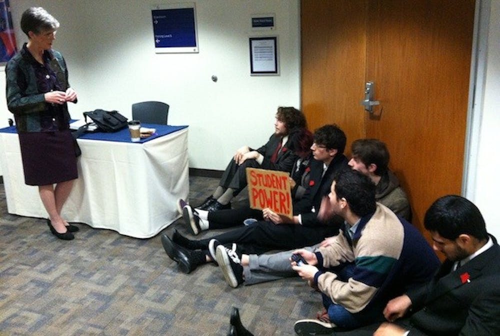 CAUS barricades door to Board of Trustees meeting