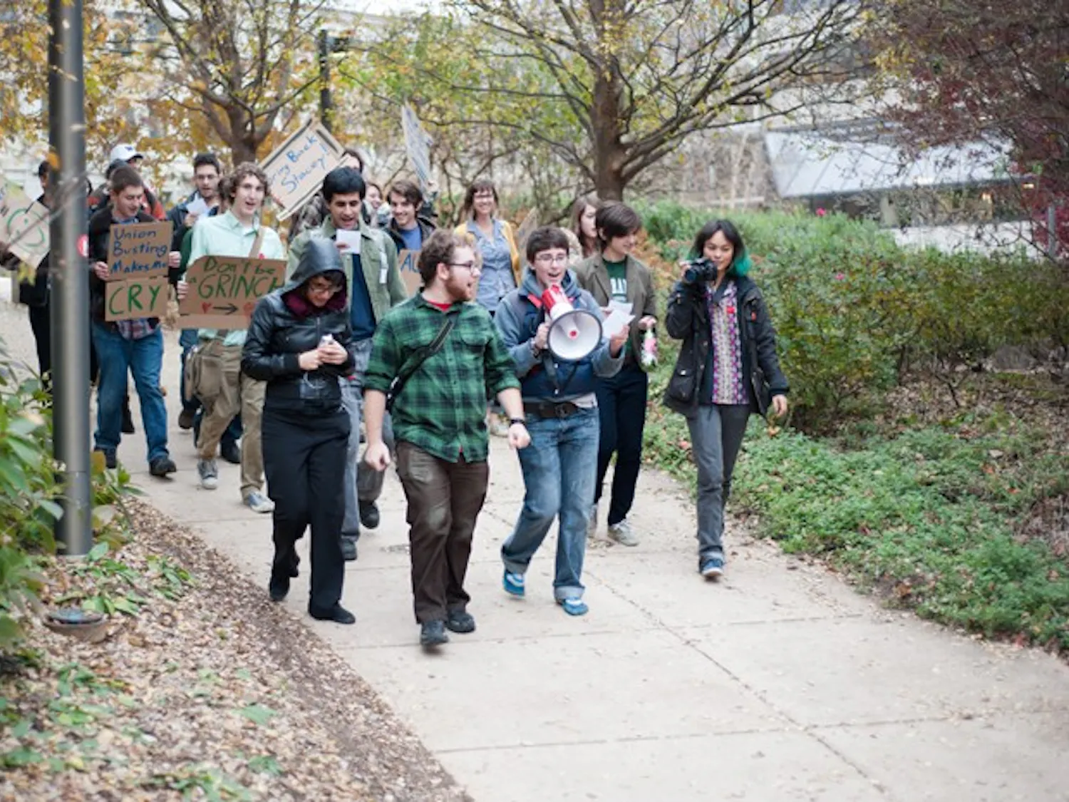 Members of the Student Worker Alliance march through the ampitheater to Provost Scott Bass\' office, chanting for the University to rehire Stacey Lucien, a secretary in the Department of Mathematics and Statistics.