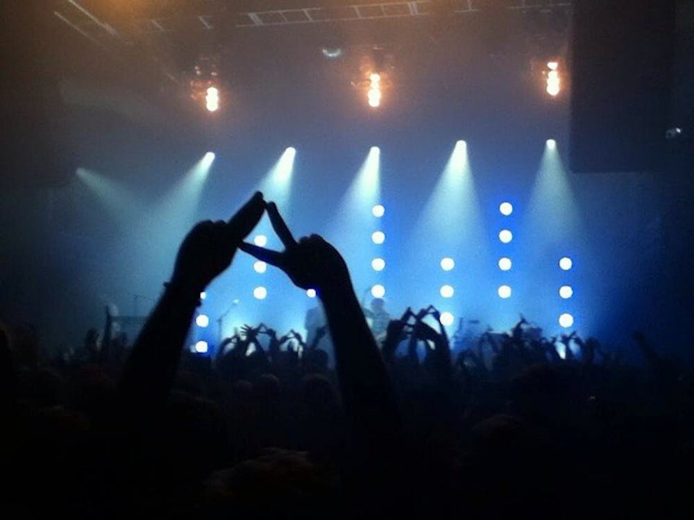 	The crowd at the Alt-J concert held their arms in the air, forming the band&#8217;s signature triangle with their thumbs and index fingers.